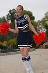 Teen cheerleader Dani Daniels pulls up her short skirt to toy her gloryhole