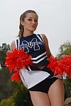 Teen cheerleader Dani Daniels pulls up her short skirt to toy her gloryhole