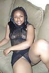 Naughty black model posing sleazy in sheer lingerie