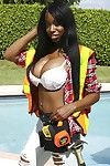 Ebony babe Codi Bryant shows her sexy body outdoor by the pool