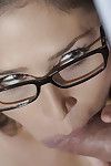 Glasses adorned dark hair office worker Anna Morna licking and sucking cock