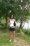 Fuckable brunette amateur undressing and spreading her legs outdoor