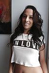 Adolescent Latin chico Nicki Ortega taking selfies in short denim shorts