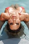 Naughty Latina chicito milf Kayla Carrera teases herself in the pool