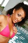 Decadent brunette in the pool in her pink bikini