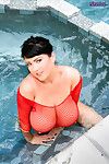 Rachel Aldana dips fall in love with the hot tub in a red fishnet shirt