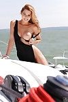 Busty pornstar Cindy Hope gets undressed off her suit and location on a boat