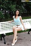 Foxy dark brown darling in miniskirt flashing her tits in public place