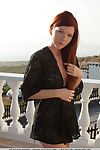 Redhead girl Mia Sollis revealing small teen tits and tight ass outdoors