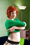 Redhead juvenile model Jette positions her hairy muff in the nude