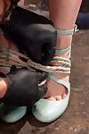 Ella is now in a wrist and ankle bondage with her hands bound to her thighs. this girl is caned and the