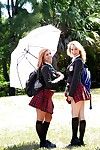 Teen schoolgirls Cali Sparks and Kelly Greene tongue mouth to mouth outdoors