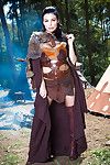 Dark brown princess Aletta Ocean striking naughty positions outdoors in cosplay getup