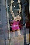 Mature lassie in provocative pink dress uncovering her gigantic bosoms