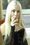 Michelle monroe smokes a 120mm cigarette in black corset