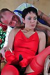 Dominative lady in red forces her gloved fingers and gear into the male arse