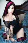 Steamy tattooed temptress slipping off her lingerie and teasing her slit