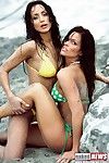 2 adventurous bikini babes at the beach