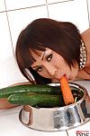 Sultry fetish doll sliding giant carrots and cucumbers in her holes