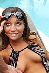 Sexy girlfriend in bikini and sunglasses flashing her enormous bosoms