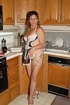 Experienced blonde lady Ivee showing off string adorned butt in kitchen