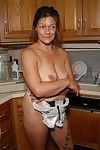 Experienced blonde lady Ivee showing off string adorned butt in kitchen