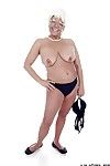 Granny pornstar Karen Summer modelling fully dressed before erotic dancing naked
