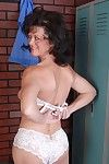 Naughty elderly Debella shows off her saggy tits in the changing room