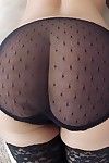Hot MILF in stockings Szilvia Lauren taking off her suit and lingerie
