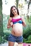 Striptease and pregnant pussy play in the outdoors.