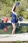 Solo babe Jodi Taylor shucking cheerleader uniform outdoors