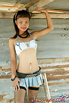 Teen looking asian teen doll in extremely short jean miniskirt